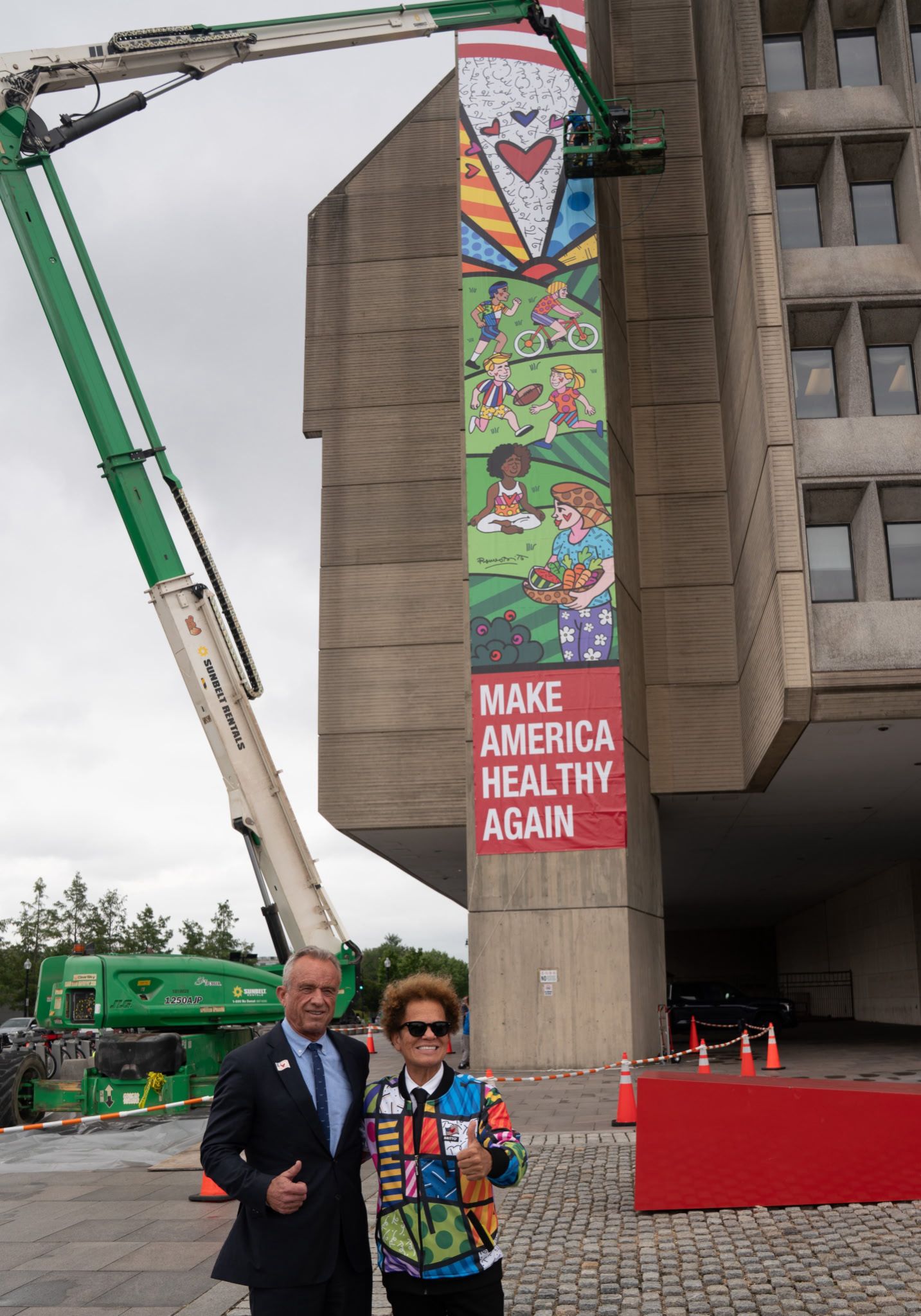 Completed public art mural installation featuring 'Make America Healthy Again' message with colorful community artwork